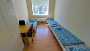 Postel nebo postele na pokoji v ubytování Happy Hotel
