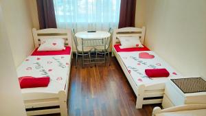 Postel nebo postele na pokoji v ubytování Happy Hotel