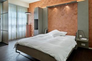 Postelja oz. postelje v sobi nastanitve Hotel du Commerce