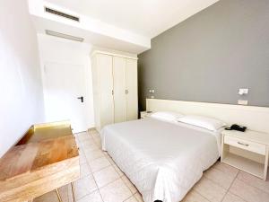 Postel nebo postele na pokoji v ubytování Aura Living Hotel