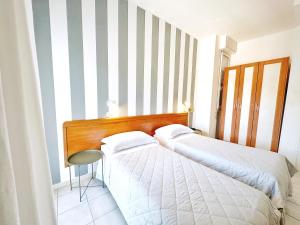 Postel nebo postele na pokoji v ubytování Aura Living Hotel