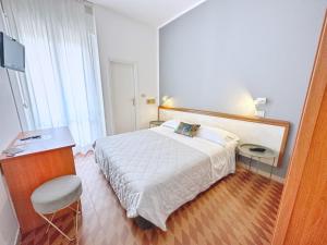 Postel nebo postele na pokoji v ubytování Aura Living Hotel