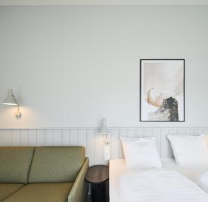 Postel nebo postele na pokoji v ubytování Hages Badehotel + 37 fotografií