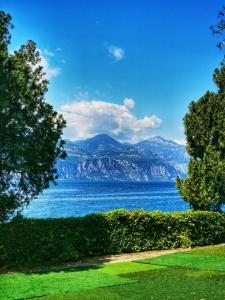 a view of a lake with mountains in the background at Camping Baldo in Brenzone sul Garda