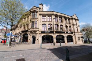 a large building on the corner of a street at Miller & Carter Sheffield by Innkeeper's Collection in Sheffield