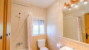 a bathroom with a toilet and a shower and a sink at El Rincón de La Iruela by Ruralidays in La Iruela +13 photos