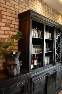 a hutch with a plant in a pot on top of it at 3 Monkeys Hotel in Steinfurt