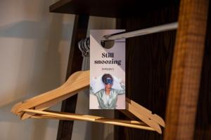 a sign hanging on a wooden shelf with chopsticks at Miller & Carter Sheffield by Innkeeper's Collection in Sheffield