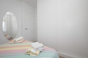 Łóżko lub łóżka w pokoju w obiekcie Apartamento Loli