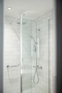 a shower with a glass door in a bathroom at Miller & Carter Sheffield by Innkeeper's Collection in Sheffield