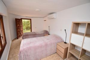 a bedroom with two beds and a window at Casa Vista Montgo Javea - 5048-3 in Balcon del Mar