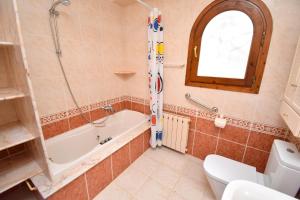 a bathroom with a tub and a toilet and a sink at Casa Vista Montgo Javea - 5048-3 in Balcon del Mar