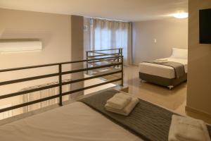 En eller flere senge i et værelse på Amaryllis Maison Emporiou