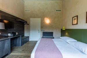 Voodi või voodid majutusasutuse Relais Le Coste toas
