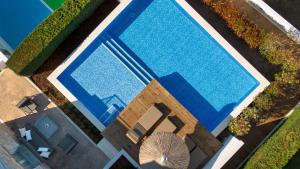 an overhead view of a large swimming pool at Kappa Resort in Paliouri
