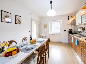 a kitchen with a table with a bowl of fruit on it at Holiday Home Le Mura by Interhome in Cividale del Friuli