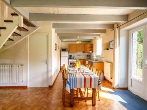a kitchen and dining room with a table and chairs at Holiday Home Pen Ilis by Interhome in Saint-Jean-Trolimon