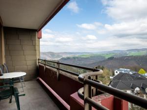 a balcony with a table and a view of the mountains at Apartment A701 by Interhome in Lahnstein