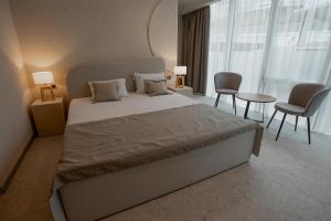 Кровать или кровати в номере Marine Residence Sea View