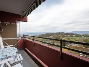a balcony with chairs and a view of the mountains at Apartment A905 by Interhome in Lahnstein