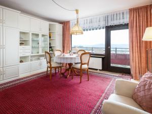 a dining room with a table and chairs at Apartment A905 by Interhome in Lahnstein