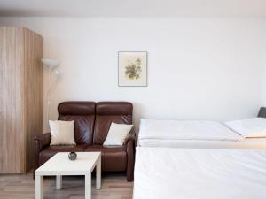 a living room with a bed and a couch at Apartment B306 by Interhome in Lahnstein