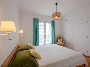 a bedroom with a large bed and a window at Holiday Home Josalie by Interhome in Sainte-Maxime