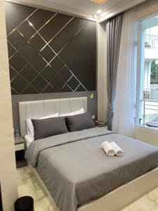 Krevet ili kreveti u jedinici u objektu Algara Puncak Hotel