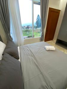 Krevet ili kreveti u jedinici u objektu Algara Puncak Hotel