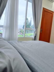 Krevet ili kreveti u jedinici u objektu Algara Puncak Hotel