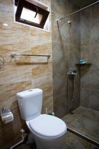 a bathroom with a toilet and a shower at Noravank L-and-L in Aghavnadzor