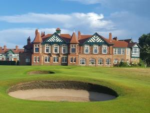 a large brick building with a hole in the grass at The Bungalow in Lytham St Annes