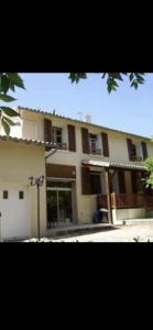 a large building with a lot of windows at Les Roseries Boutique Gite in Clussais-la-Pommeraie