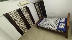 a small room with a bed and a window at Kizhakkethottam Homestays-River View Villa in Pala