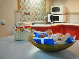 a bowl of food on a counter in a kitchen at Carmona Center Apartment in Carmona