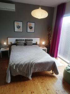 Postel nebo postele na pokoji v ubytování Apartments Villa Dona