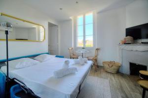 Posteľ alebo postele v izbe v ubytovaní IMMOGROOM-Suquet-AC-WIFI-close to the beaches