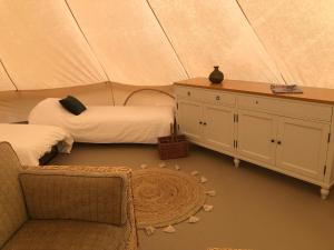 a room with two beds in a tent at Old Oak Farm 