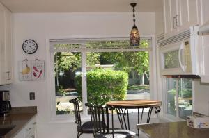 a kitchen with a table and a large window at Palo Alto Quiet 1 Bedroom Stanford University in Palo Alto
