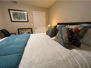 a bedroom with a bed with pillows on it at Palo Alto Quiet 1 Bedroom Stanford University in Palo Alto
