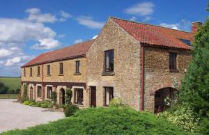 an old brick house with a red roof at Valerian in York