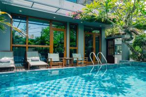 Басейн в CHiEM HoiAn - The Beachside Boutique Hotel & Villa або поблизу