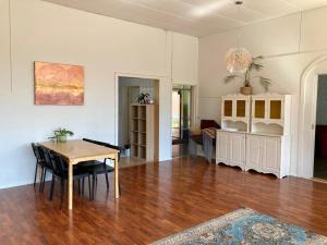 a living room with a table and a dining room at Kotapiha in Liperi