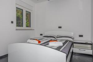 Postel nebo postele na pokoji v ubytování Apartments Marija