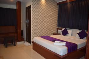 Postel nebo postele na pokoji v ubytování Hotel UR Comforts Jayanagar