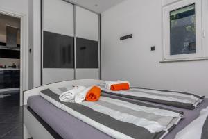 Postel nebo postele na pokoji v ubytování Apartments Marija