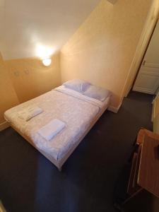 Een bed of bedden in een kamer bij Chez Marie et Didier Chalet saint Jacques