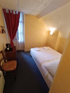 Llit o llits en una habitació de Chez Marie et Didier Chalet saint Jacques