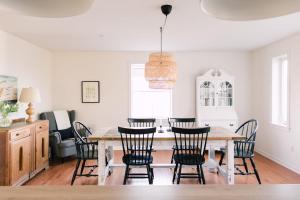 a dining room with a table and chairs at Fox Lane - Prince Edward County Farmhouse in Picton