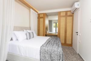 Postel nebo postele na pokoji v ubytování Kaktus Suites Private Pool
